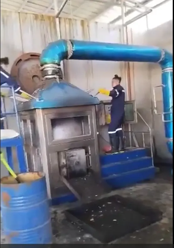 Operator loading a GREENASH 5 at a medical waste facility