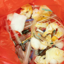 Medical waste in a red bag